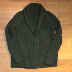 Green open-front sweater.